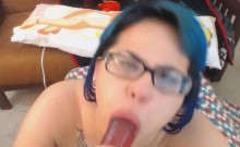 Closeup Squirt Blue Hair Punk Teen With Tattoos and Glasses
