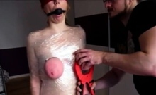 extreme tits punishment, wrapped in plastic